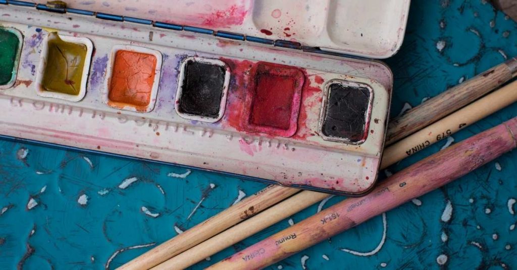 Watercolor half pans and paint brushes