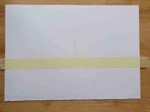 strip of masking tape on a white page
